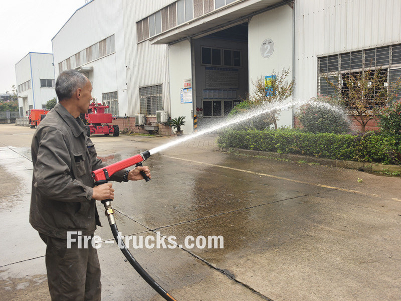 ISUZU 600L water foam fire truck hose reel jetting ISUZU 600L water foam fire truck hose reel jetting
